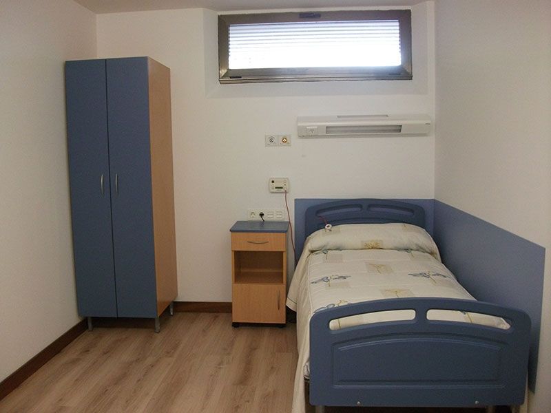 Residencia Los Rosales habitación con una cama